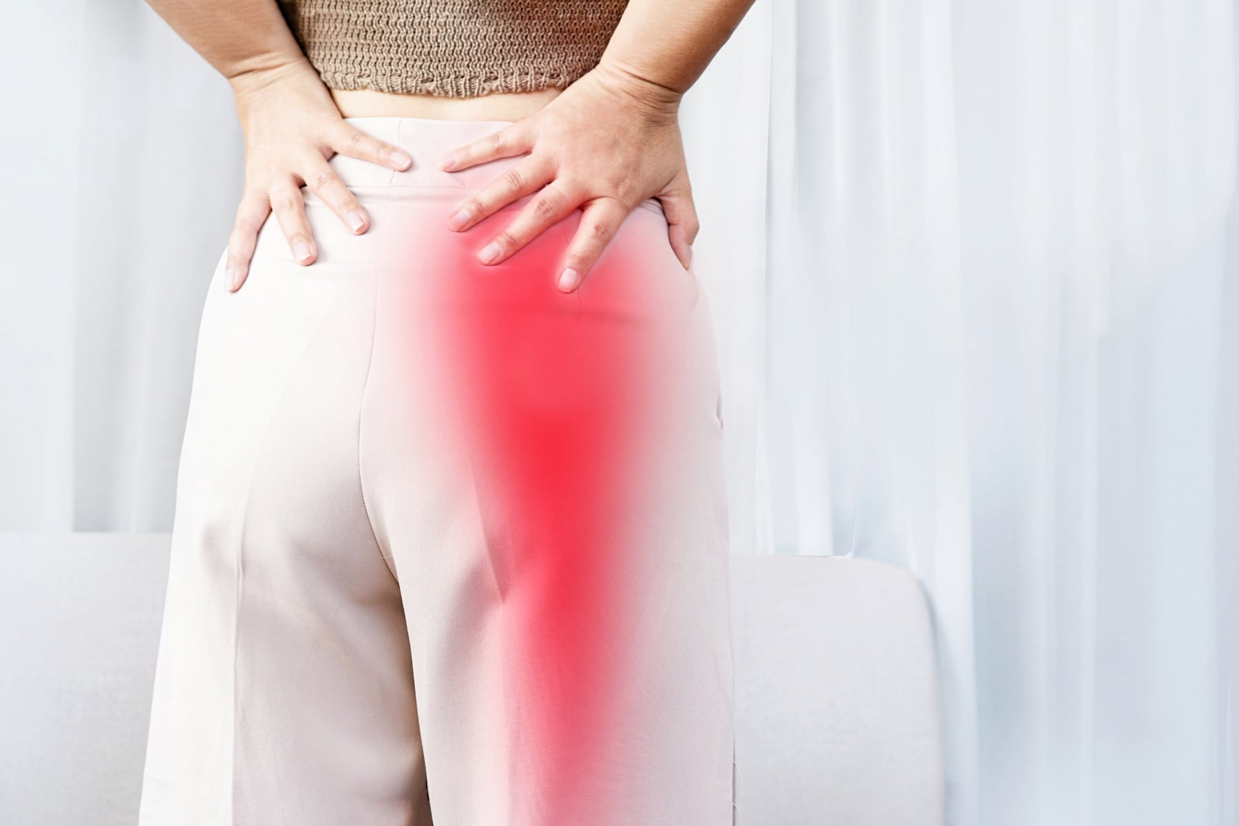 Person experiencing sciatica pain radiating down the leg, treated with remedial massage at Nexus Bodywork Clinic in Malvern East.